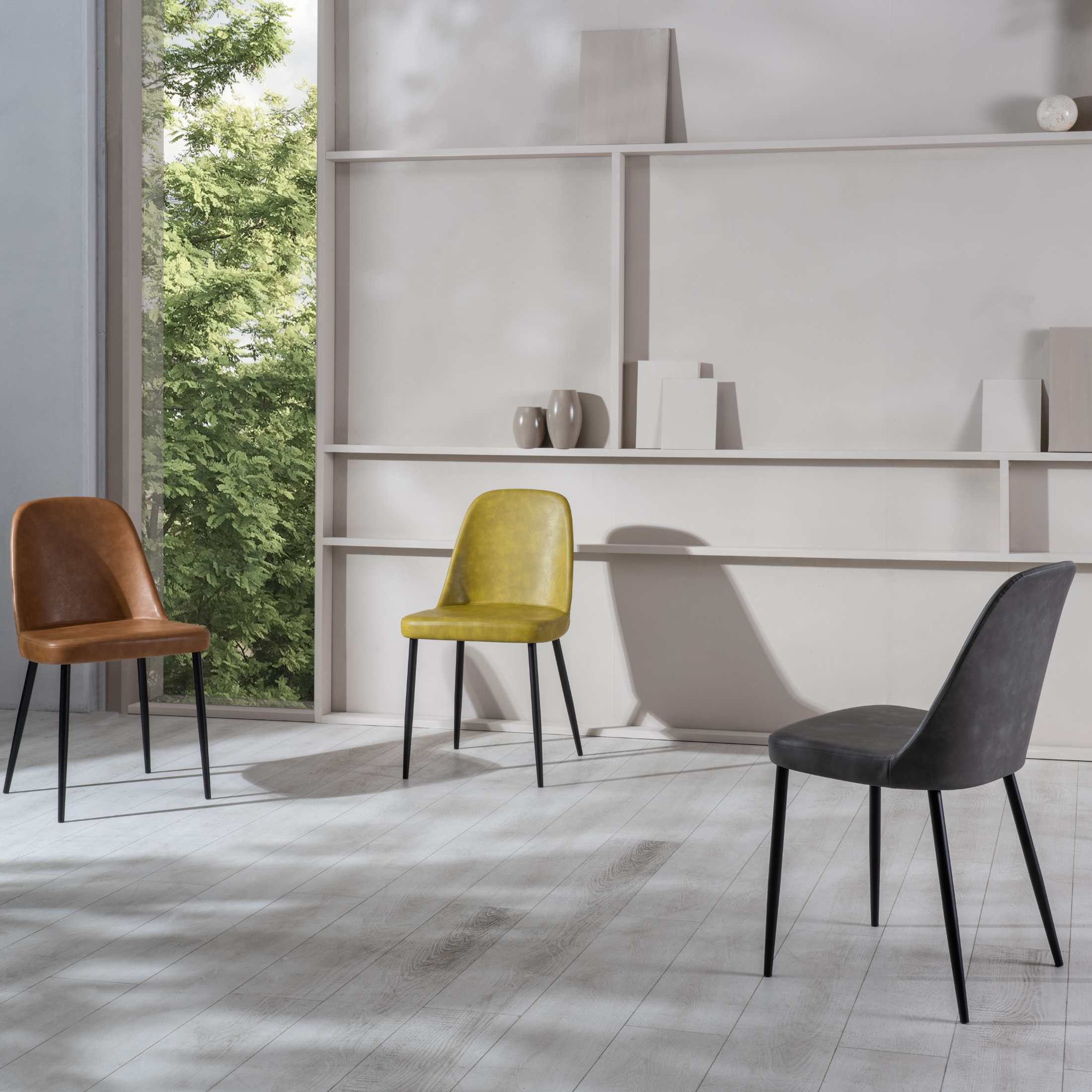 Set of modern "Damasco" dining chairs upholstered in soft-touch faux leather