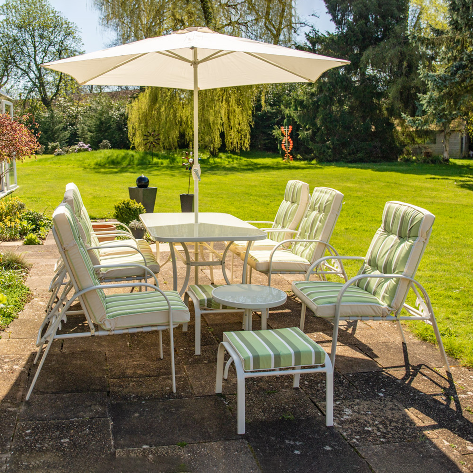 "Giove" metal dining table with tempered glass top and umbrella holder for the garden