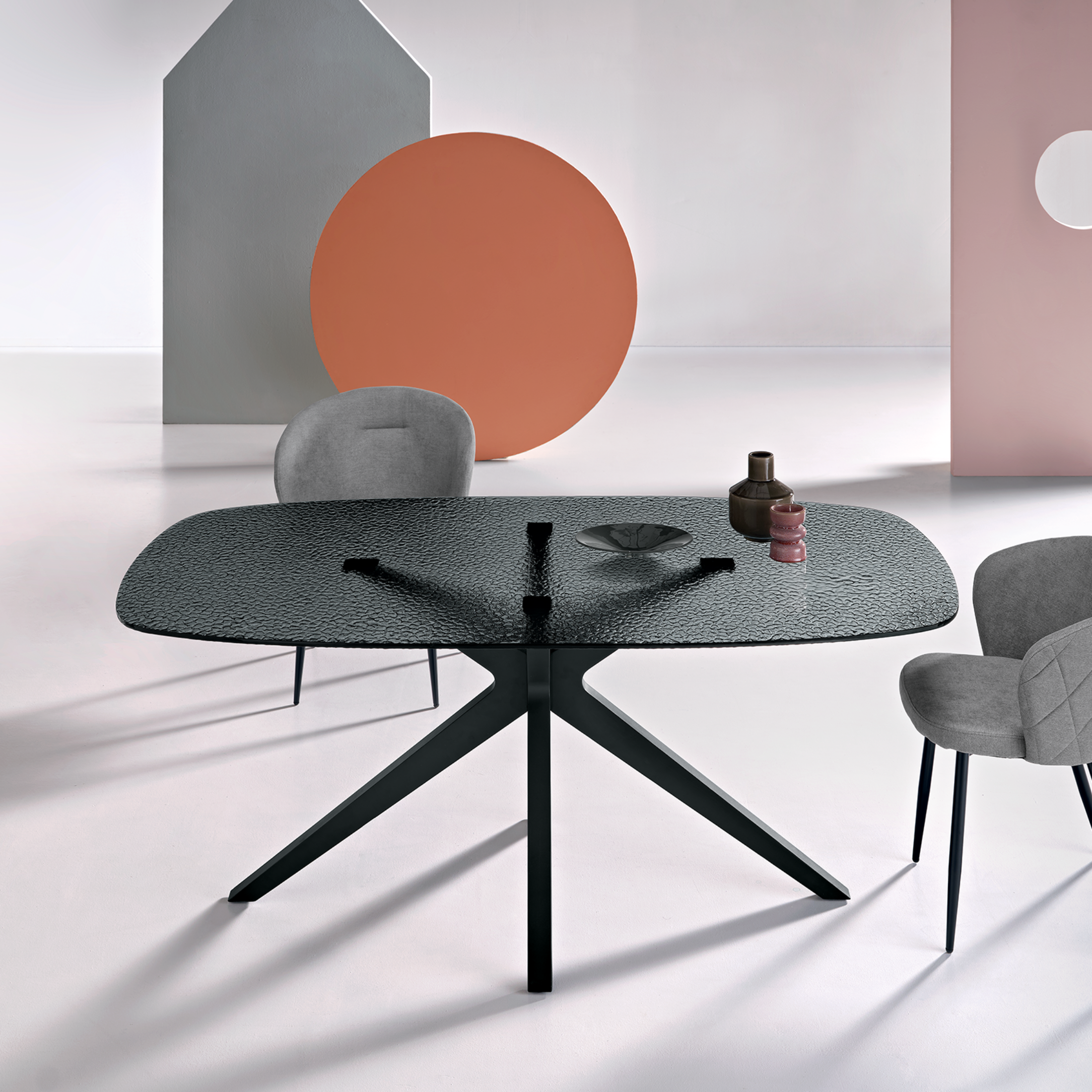 "Eivissa" modern fixed table with smoked hammered glass top and metal base