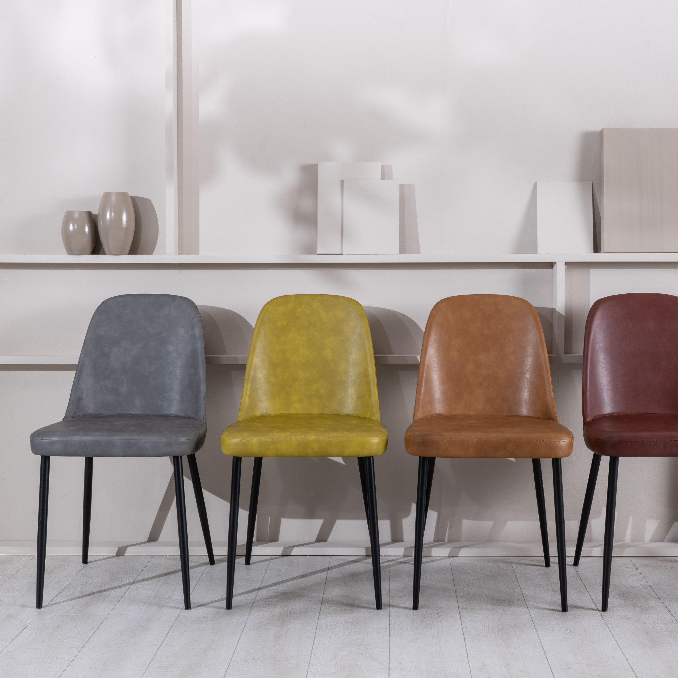 Set of modern "Damasco" dining chairs upholstered in soft-touch faux leather