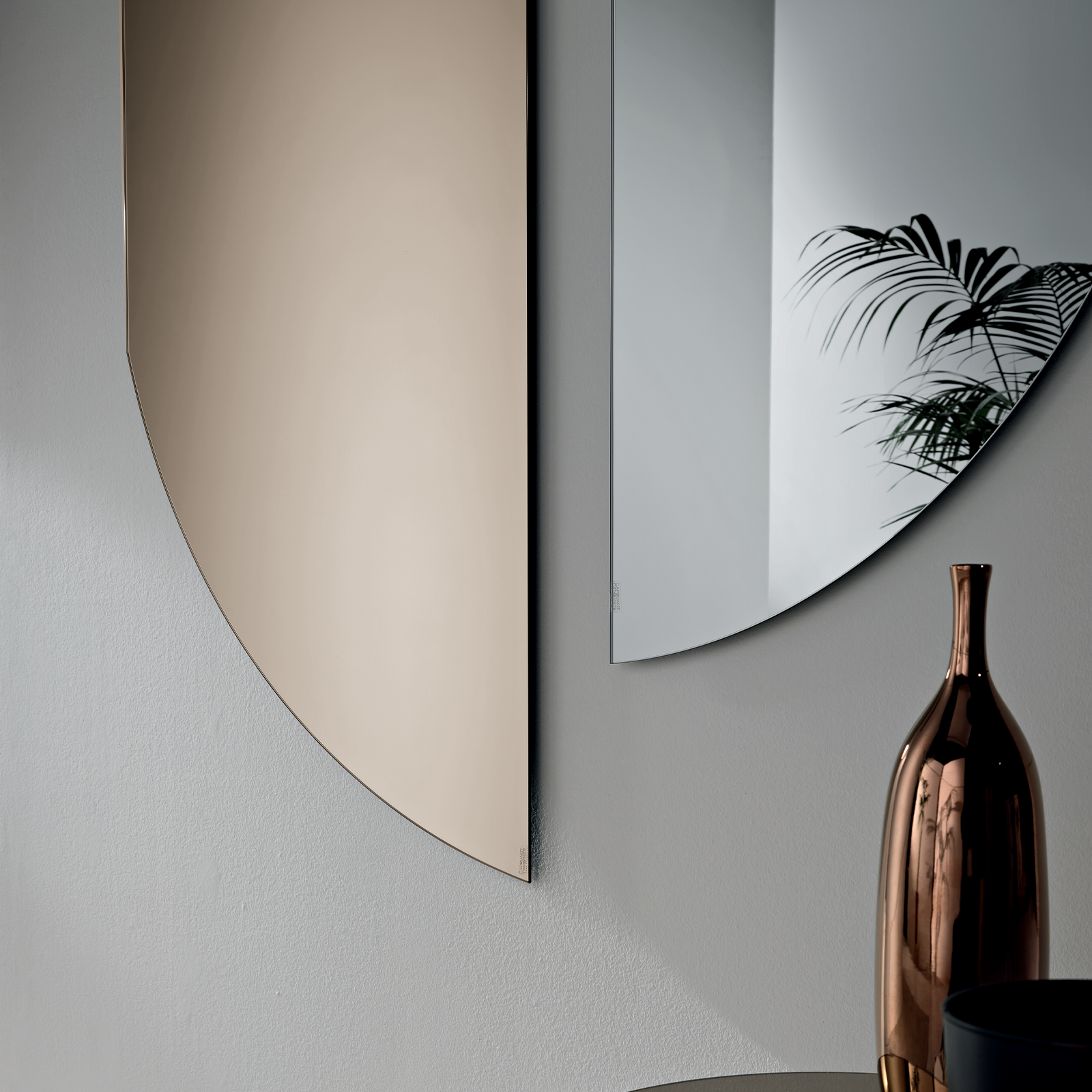 Modern frameless "Fusion" shaped mirror with a versatile and contemporary design