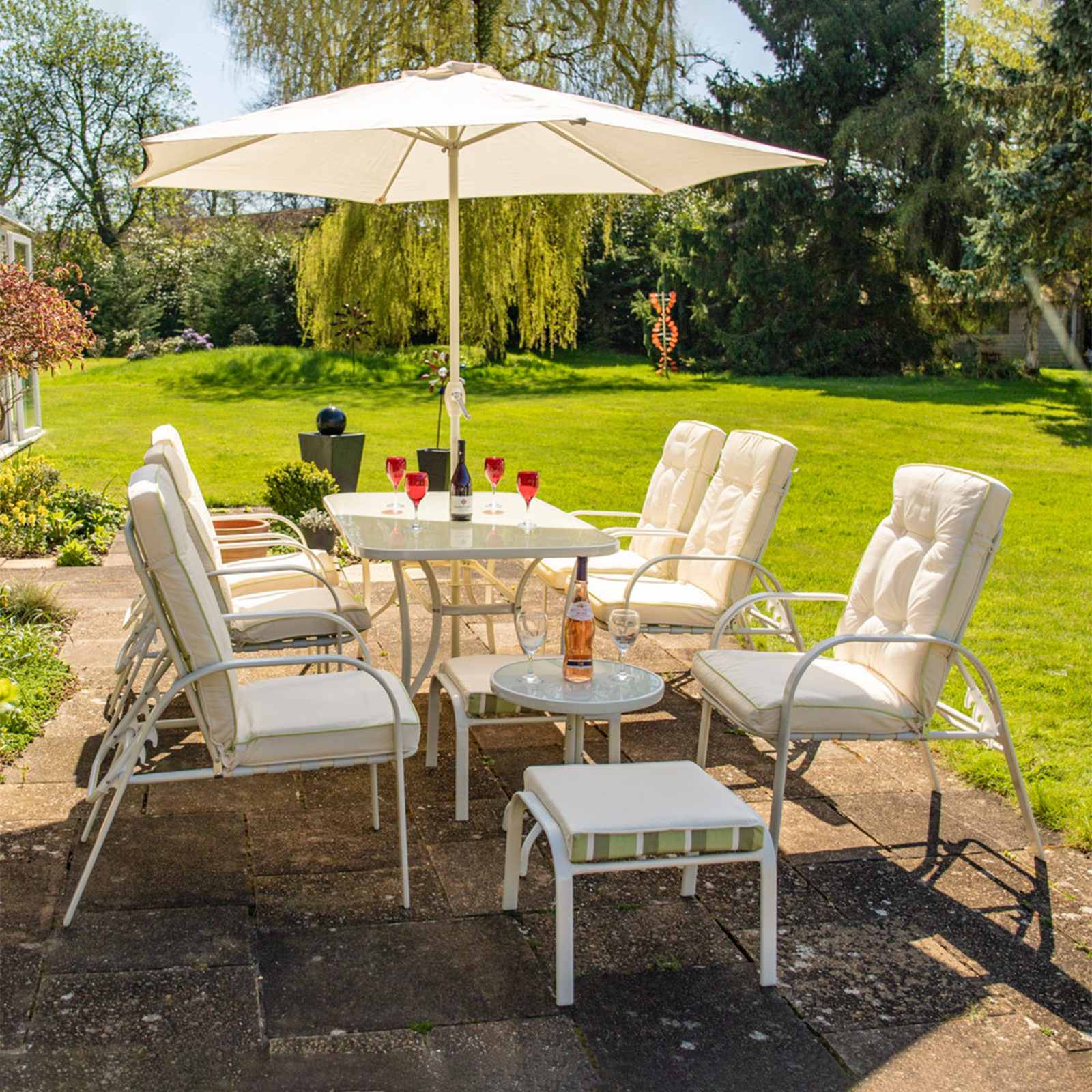 "Giove" metal dining table with tempered glass top and umbrella holder for the garden