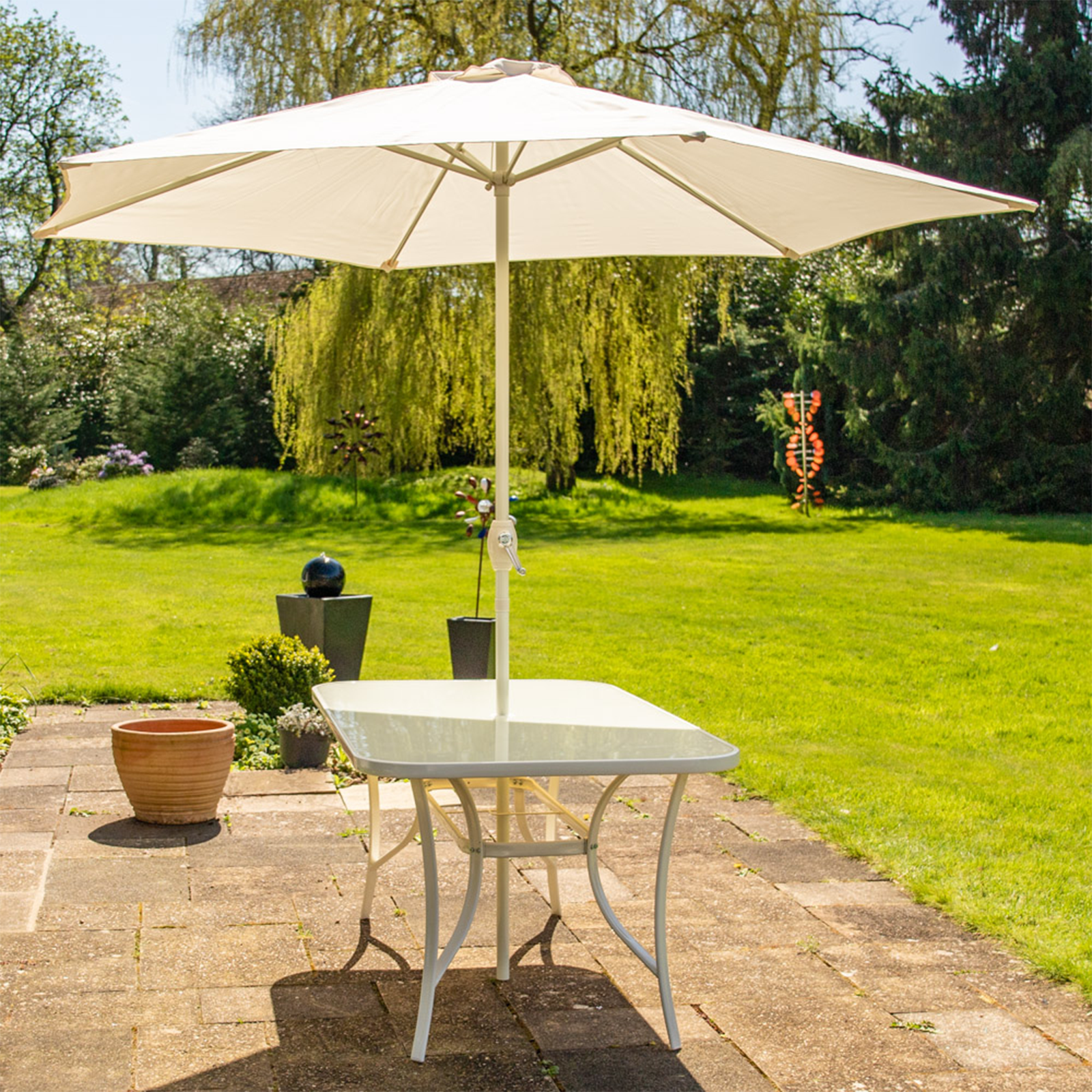 "Giove" metal dining table with tempered glass top and umbrella holder for the garden