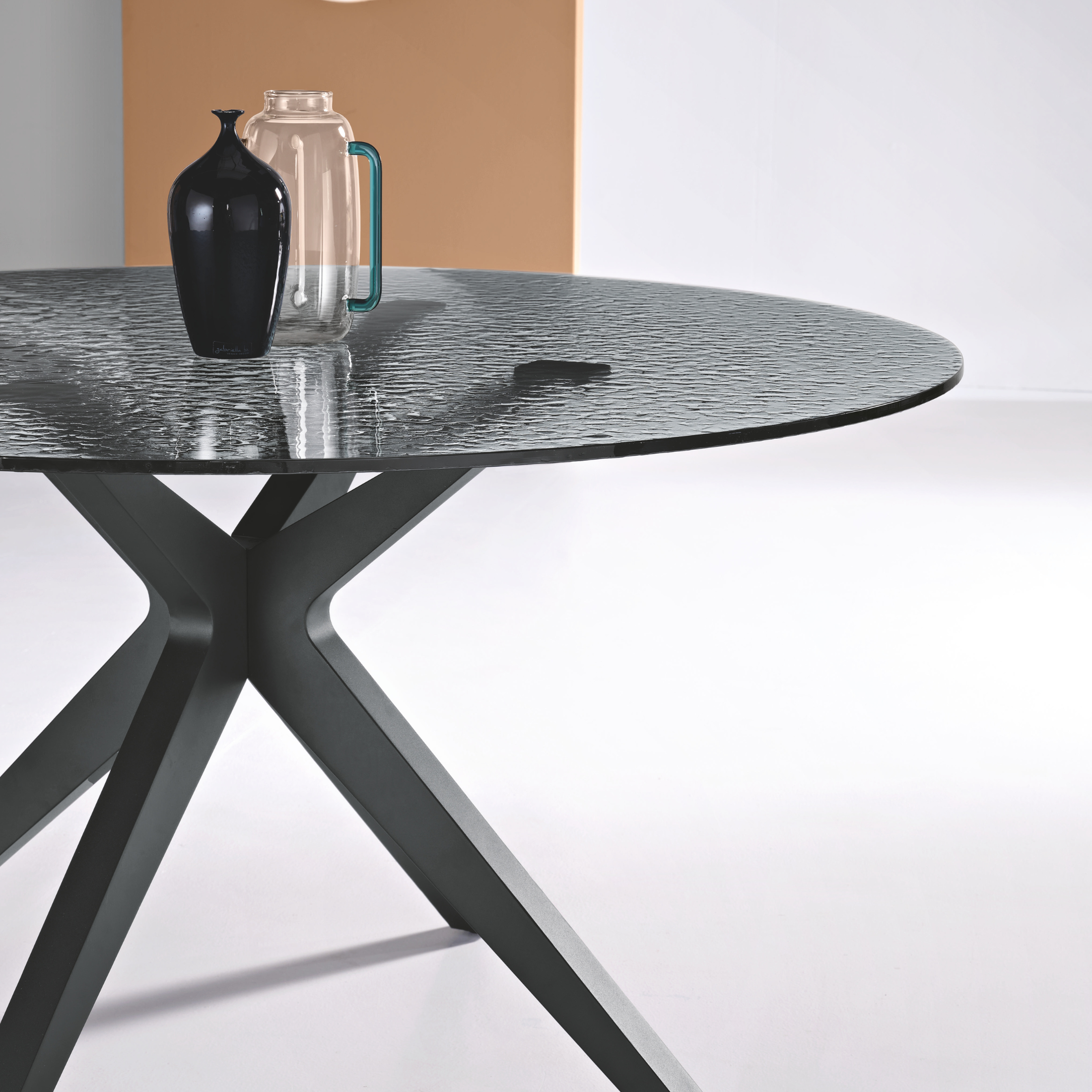 "Eivissa" modern fixed table with smoked hammered glass top and metal base