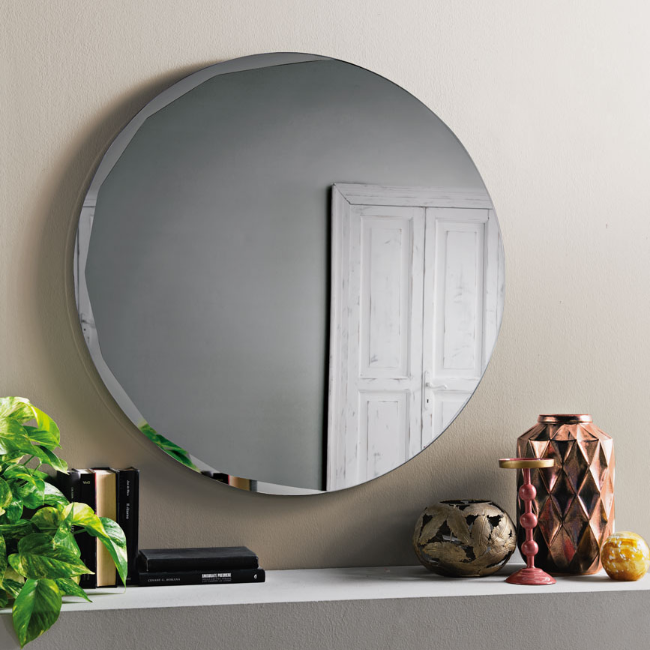 "Pretty" modern round wall mirror with side bevel detail