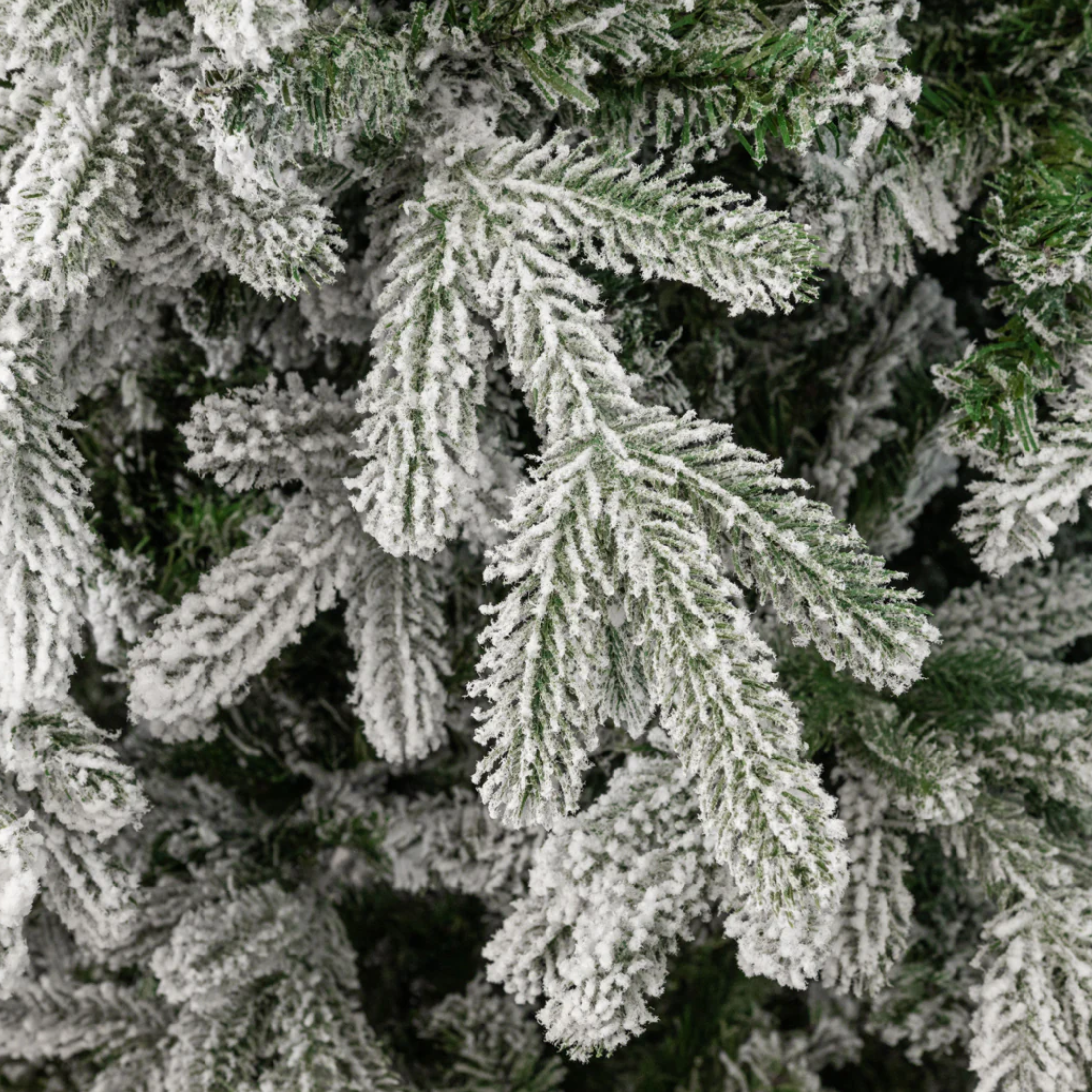 Snow-covered "Feather" Christmas tree in PE with Real Touch + Flock effect of the highest quality