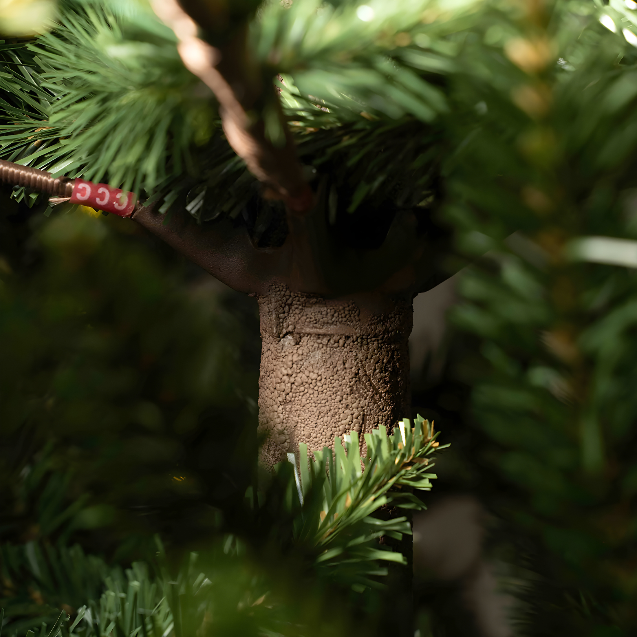 Rudolph Christmas tree with LEDs and brown trunk made of 80% PE with a Real Touch effect.