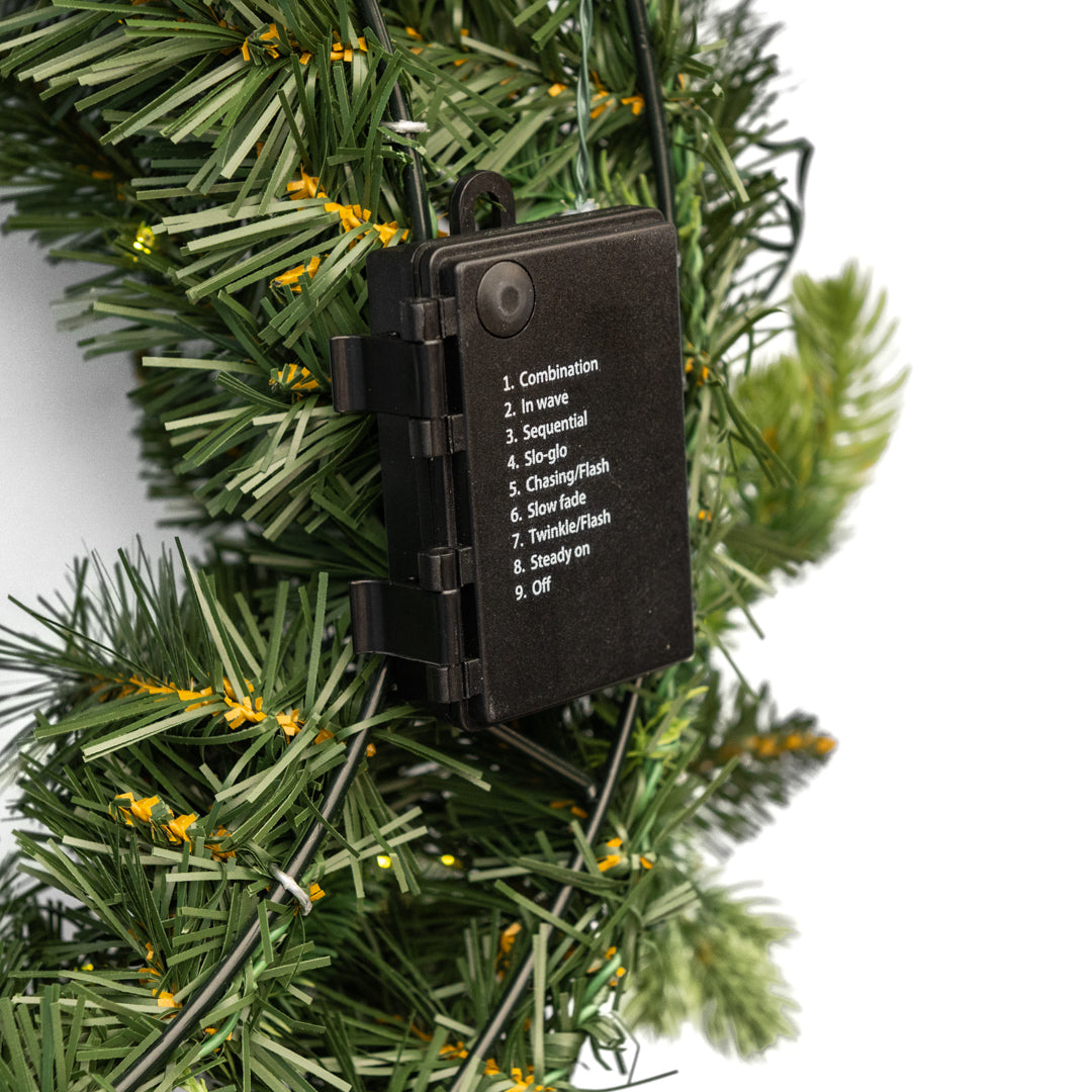 "Madame" Christmas wreath with micro-LEDs behind the door in PE with a real-touch effect